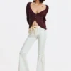 Flared jeans with frayed edges