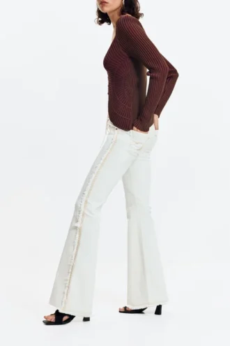 Flared jeans with frayed edges