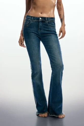 Flared jeans with frayed edges