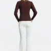 Flared jeans with frayed edges