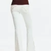 Flared jeans with frayed edges