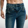 Flared jeans with frayed edges