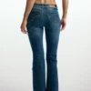 Flared jeans with frayed edges
