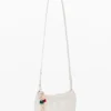 Grote crossbody-portemonnee met bedeltjes