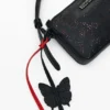 Kleine crossbodytas met bedeltje