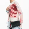 Kleine crossbodytas met bedeltje
