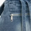Kleine denim rugzak met bedeltjes