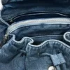Kleine denim rugzak met bedeltjes
