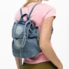 Kleine denim rugzak met bedeltjes