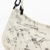 Kleine gevlochten tas met letters