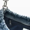 Middelgrote ovale tas met bedeltjes