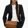Middelgrote tas met logo en bedeltjes
