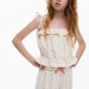 Tops met pomponbandjes