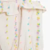 Tops met pomponbandjes